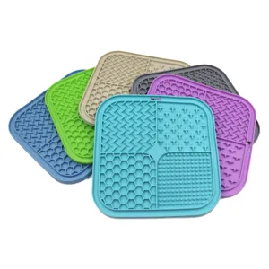 Close-up of silicone pet lick mats in various colors showing diverse surface textures