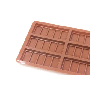 Silicone chocolate mold detail view, flexible brown baking tray for homemade candy and waffle treats.