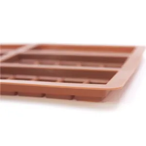 Close-up detail shot of the brown rectangular silicone baking mold with flexible texture cavities.