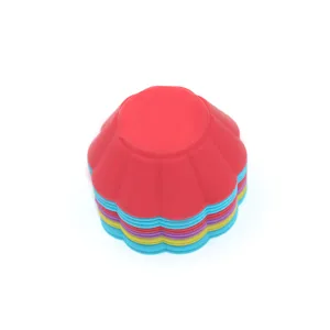 Detailed view of colorful silicone muffin cups, flexible baking molds for homemade cupcakes.