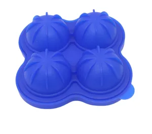 Close-up detail of the blue silicone 4-cavity sphere ice mold showing flexible texture.