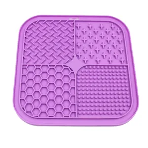 Close-up of a purple silicone pet lick mat featuring four distinct textured patterns