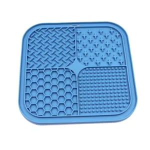 Detail view of blue silicone pet lick mat with four unique slow feeding textures.