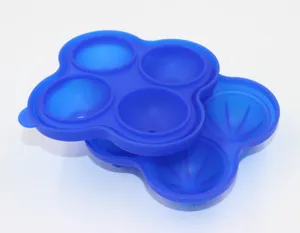 Detail view of the 4-cavity blue silicone ice tray mold, flexible and easy to release for DIY use.