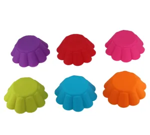 Colorful silicone muffin cups and round cake mold detail showing mini baking tools set.