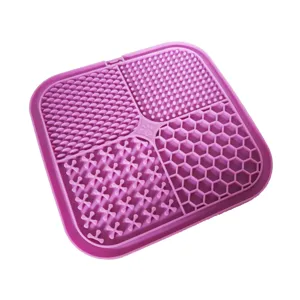Silicone pet lick mat detail showing four textured quadrants for slow feeding, cat and dog.