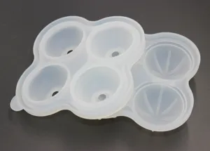 4-cavity silicone ice ball mold for making spheres and diamonds, flexible kitchen tool.