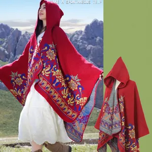 Red knitted hooded poncho cloak with vibrant ethnic jacquard floral pattern details