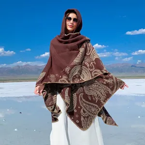 Detailed view of a premium thick brown knit hooded shawl featuring ornate paisley patterns.
