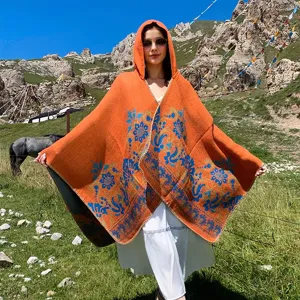 Orange knitted hooded shawl with vintage blue jacquard floral pattern for outdoor travel