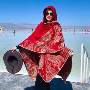Elegant red knitted hooded shawl with ethnic paisley patterns for travel