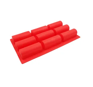 Detailed view of the 9-cavity silicone baking mold, showing flexible red long strip cavities.