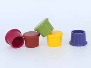 Detail shot of multi-color silicone wine bottle stoppers, flexible food grade sealing caps.