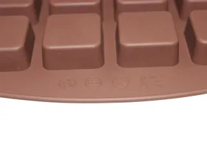 Close-up of 24-cavity square silicone mold showing temperature resistance markings