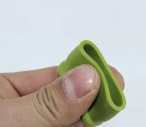 Flexible green silicone wine bottle stopper detail showing elasticity and leakproof design.