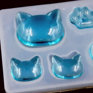 DIY cat paw resin silicone mold detail view, transparent blue craft pendant making tool.