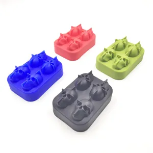 Detailed view of four colorful skull-shaped silicone ice trays for Halloween gifts