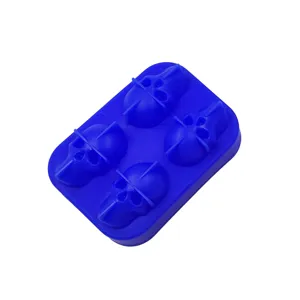 Detailed view of blue silicone ice cube tray featuring four skull-shaped cavities