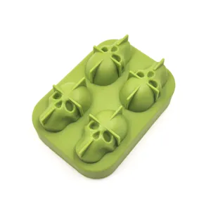 Top view of a green silicone skull ice cube tray mold with 4 detailed cavities