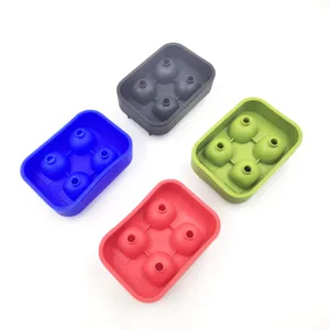 Detail of 4-cavity silicone skull ice trays in blue, black, green, and red colors