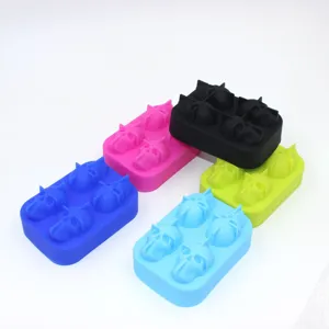 Close-up of 4-cavity skull-shaped silicone ice cube molds in five vibrant colors