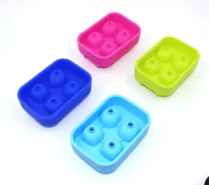 Four colorful 4-cavity silicone skull ice cube trays in pink green and blue for Halloween