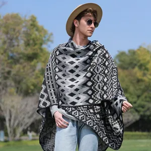 Macro view of men's geometric knit poncho showing intricate patterns and texture