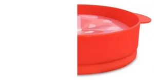 Red silicone popcorn maker detail, microwave safe bowl with lid and handle for easy kitchen use.
