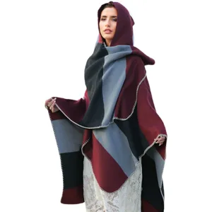 Women's hooded color-block poncho shawl featuring elegant blanket stitch detailing
