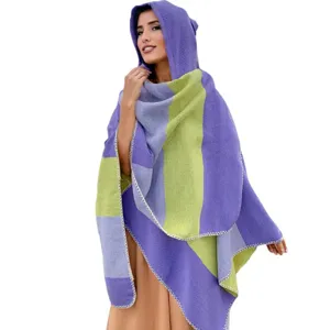 Detailed macro view of hooded knit poncho shawl featuring vibrant purple and green stripes