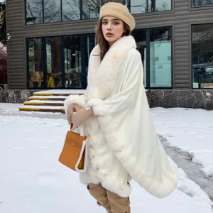 Close-up of elegant white fur trim shawl worn by a model in a snowy winter scene