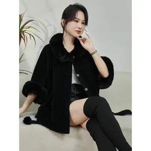 Elegant woman wearing black faux mink fur cloak with large collar and belted waist