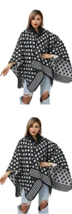 Detailed view of women's black and white checkered knit poncho shawl for winter warmth.