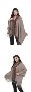 Elegant winter brown knitted shawl with faux fur collar and long fringe details on model