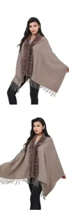 Winter knit shawl poncho with faux fur collar and fringe tassels detail for women