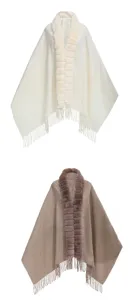 Detailed view of white and brown knit ponchos with faux fur collars and tassels