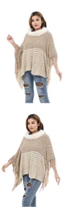 Close-up of women's knit poncho featuring white faux fur collar and tassels