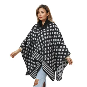 Stylish black and white geometric patterned knitted hooded poncho shawl for women winter wear