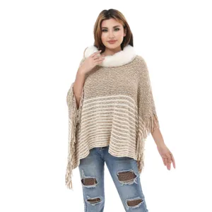 Elegant women's knitted poncho shawl with faux fur collar and fringe tassels in beige
