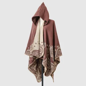 Cozy hooded knitted poncho with paisley patterns in a chocolate and beige color palette.
