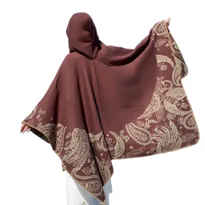 Vintage brown knitted hooded poncho with bohemian paisley pattern for autumn and winter warmth