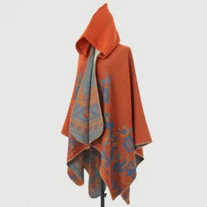 Detailed view of the vintage jacquard pattern on a thick hooded knitted poncho