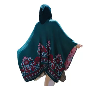 Ethnic style hooded knitted poncho with red jacquard floral pattern in dark teal