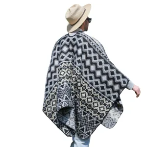 Warm men's knitted poncho featuring a grey geometric tribal pattern and split hem