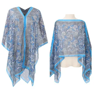 Lightweight blue chiffon beach cover-up with detailed white paisley pattern and V-neckline