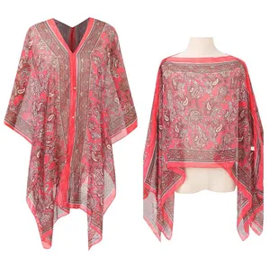 Detailed view of red paisley print chiffon beach cover-up and versatile shawl