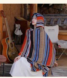 Detailed view of women's ethnic style hooded poncho with colorful vibrant stripes