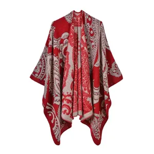 Detailed view of an ethnic style red knitted shawl featuring intricate vintage pattern design