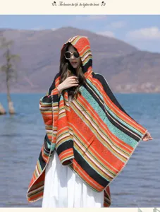 Ethnic style striped hooded poncho for women, perfect for travel and outdoor wear.
