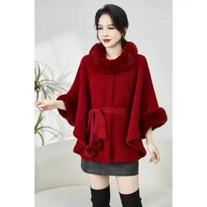 Detailed view of red faux mink fur poncho with large collar and waist belt decoration.